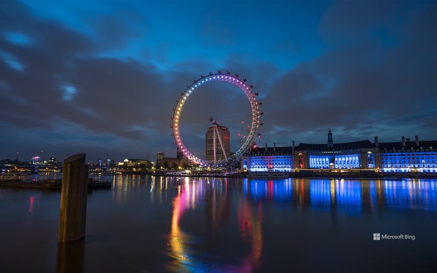 London Eye illuminated at dawn, England