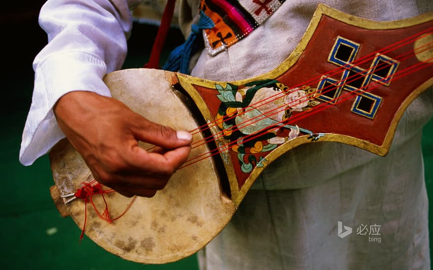 Tibetan lyre playing in Lhasa Norbulingka, Tibet